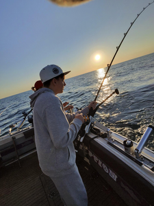 Perfect sunset fishing session using deep sea trolling with heavy tackle. Clear conditions made for an exciting adventure on the water.