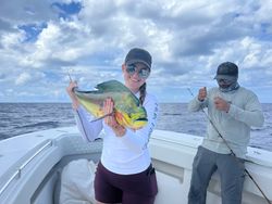 Three anglers holding their catch at Lake Worth