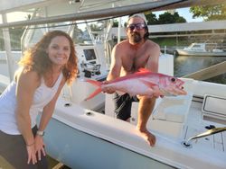 Two anglers fishing in FL with a single fish