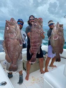 Three anglers with big 40-inch fish at Lake Worth