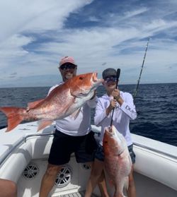 Two anglers with big 31-inch fish on Dauphin Island cruises and fishing trip