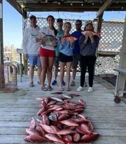 6 people in a boat on the water in AL