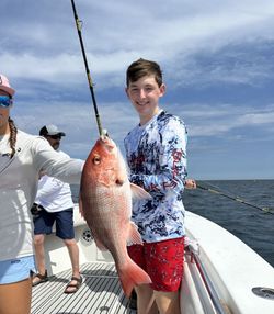 Two people on a cruises and fishing trip at Dauphin Island