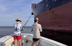Man fishing in Alabama, enjoying cruises and fishing activities