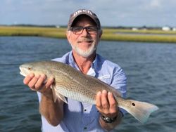 Angler reeling in a 22-inch catch in North Carolina