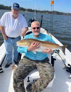 Two people enjoying cruises and fishing in North Carolina