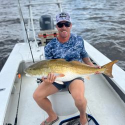 A single fisherman in North Carolina cruising and fishing