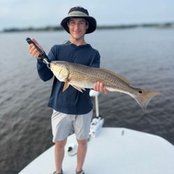 A redfish caught by a person in Hubert