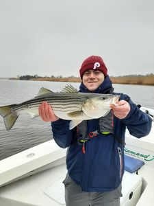 Proud angler with a striped bass!