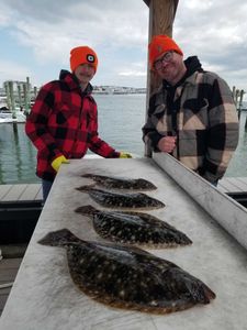 Four summer flounder and bartail flathead fish caught in Avalon