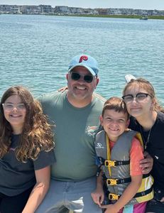 Four people enjoying a fishing trip in NJ