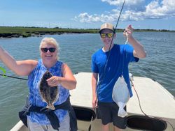 2 summer flounder fish caught in Avalon while fishing