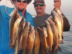 Two people fishing for spotted weakfish in Mississippi