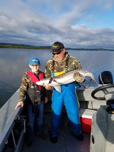 Two people fishing in Warrenton with a 25-inch fish