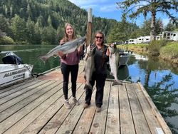 Two people fishing with three fish in Otis