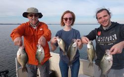 Five crappie fish caught by three people while fishing in Cameron