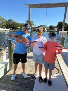 Two people enjoying a great fishing trip in FL