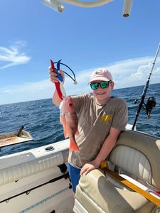 Angler with fishing rod enjoying the scenic view in Niceville