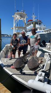 4 people fishing in FL with a 24-inch fish