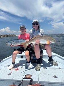 Two redfish and little tunny, 30-inch fish, fishing in FL