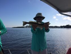 A lone angler reeling in a 19-inch catch in Freeport