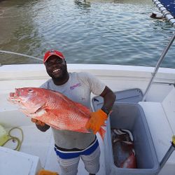 Angler with a single 19-inch fish in Buccoo