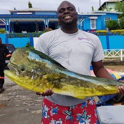One fisherman catching a 27-inch fish in Buccoo