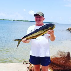 Fisherman with a 23-inch catch in Buccoo