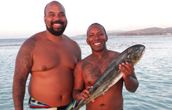 Two people fishing in Buccoo