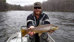 Angler holding a sea trout fish in Michigan