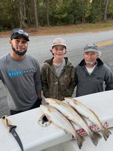 Three people fishing in North Carolina