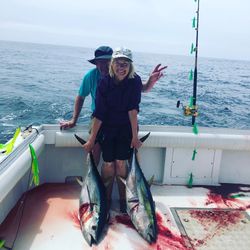 2 anglers fishing in New Jersey with their catch