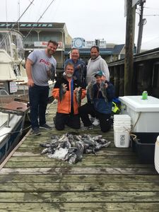 Group of five people fishing in Cape May