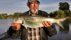 Angler with a 23-inch fish in Olivehurst