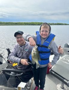 A photo of two people fishing for crappie in Duluth.