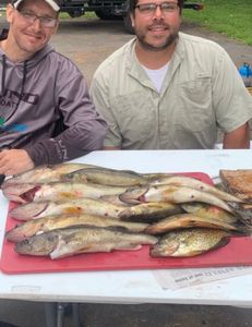 Two people fishing with three unspecified fish in Minnesota