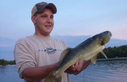 Two people fishing in MN with one fish