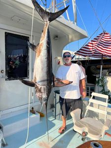 Large swordfish catch displayed on fishing boat deck in Key West FL