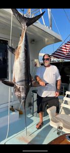 Large swordfish caught on fishing charter in Key West FL displayed on boat deck