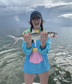 Angler holding freshly caught fish on boat in Corpus Christi TX waters