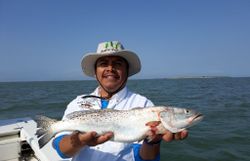 A lone fisherman in TX enjoying their catch.