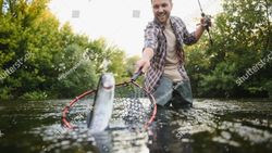 Fish caught in landing net during fishing trip in Florida City FL