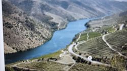 Aerial view of winding river through terraced hillsides and mountainous terrain in Florida City FL