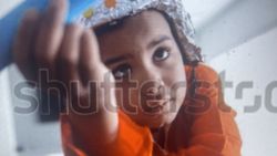 Close-up view through fingers showing fishing or water sports activity in Florida City FL