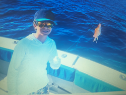 Nice catch! Orange fish from the blue waters at Butler Beach.