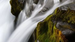 Cascading waterfall flowing over moss-covered rocks in Florida City FL