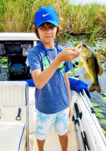 One person fishing in FL with a rod and reel