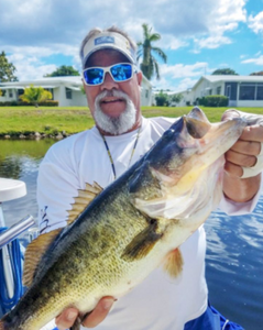 A lone fisherman in FL catching a 20-inch fish