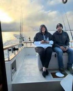 Two people fishing together in California