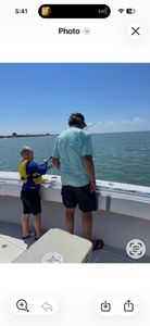 Fishing boat on water near Port O'Connor TX with fishing rods extended